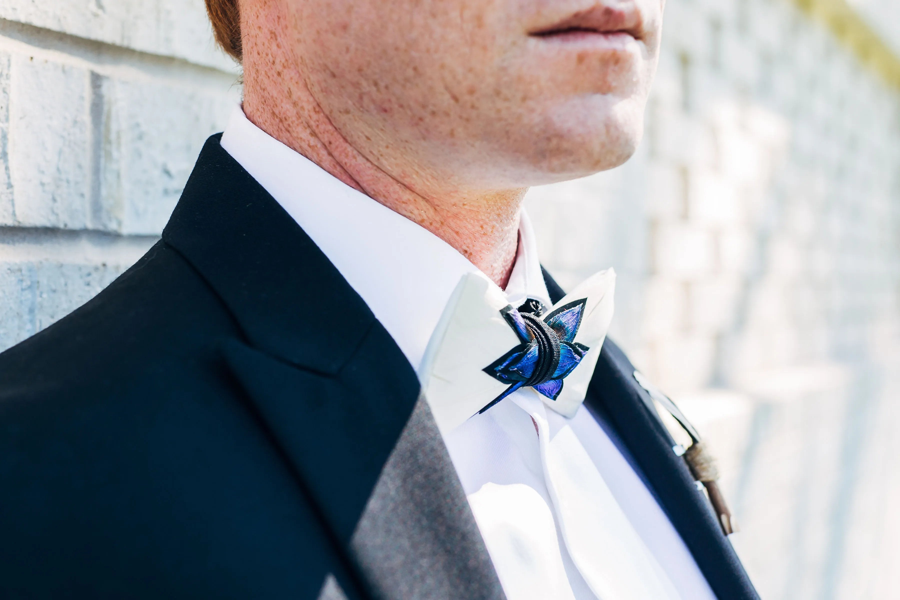 Clay Mandujour model wearing  feather bow tie